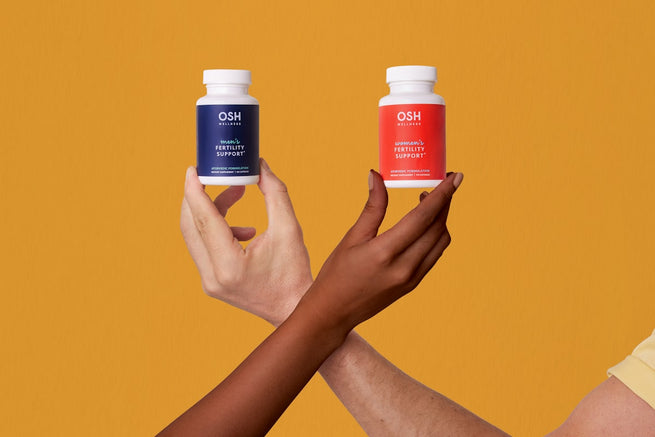 Woman holding supplement bottles for UTI prevention